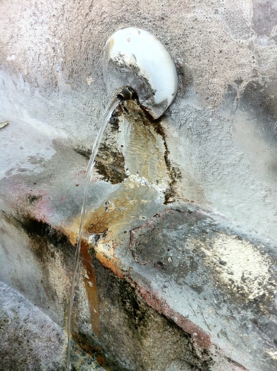 Holy water trickling from the wall.